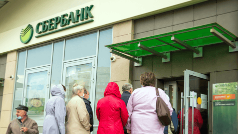 Sberbank logo, people waiting in line