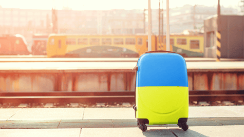 Suitcase of blue and yellow color oa railway