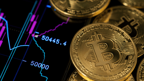 Concept picture of cryptocurrency coins scattered across a trading screen.