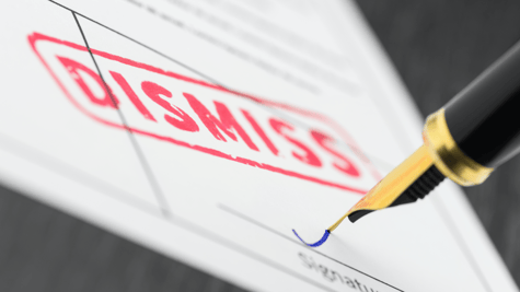 Seal dismiss stamped on a document and fountain pen