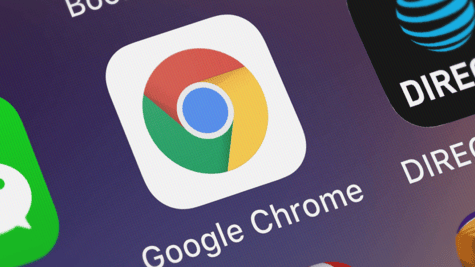 Close-up of Google Chrome browser logo on cellphone.