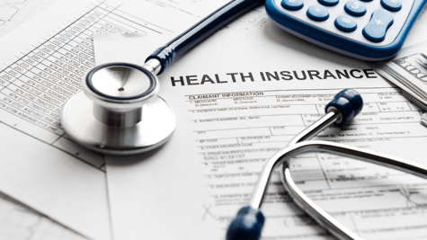 Medicare form with doctor equipment and a mobile phone