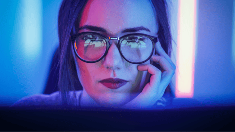 woman looking into a computer screen