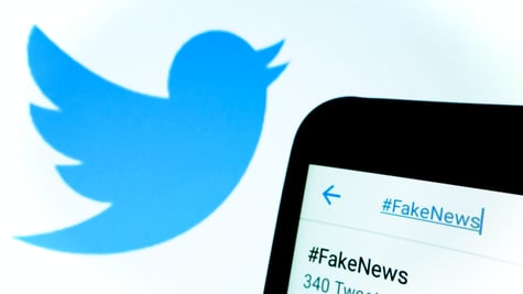 Twitter logo and fake news hashtag