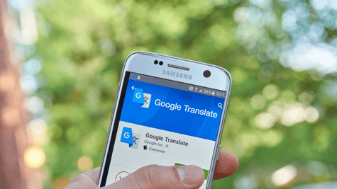 Google Translate on cellphone held in hand