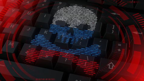 Skull in the color of the Russian flag on the background of the keyboard