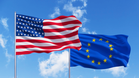 EU and US flags blue sky background