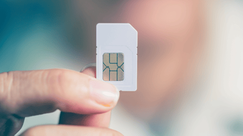 Ordinary SIM card held aloft