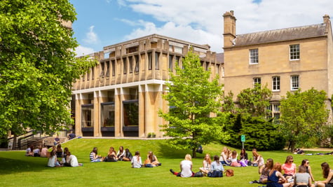 Students on the lawn in front of Oxford University