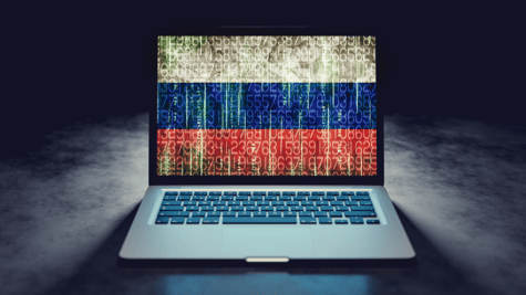 Russian flag on laptop screen in binary