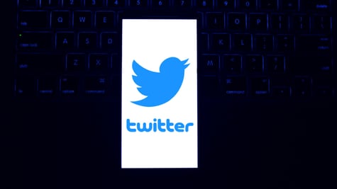 Twitter logo laptop keyboard