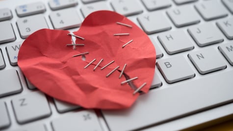 Romance scam heart and keyboard