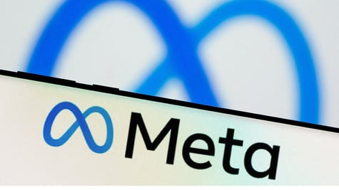 Meta Platforms Inc's logo is seen on a smartphone
