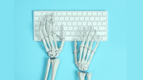 hands of a skeleton typing