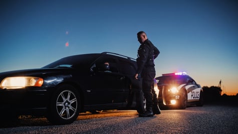 police officer pulls over car, police patrol