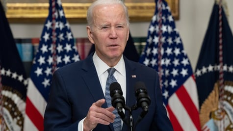 Biden at podium, flag in back ground