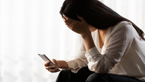 woman-sad-phone