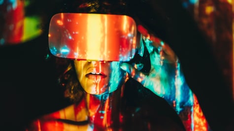 Woman wearing AR glasses in the dark