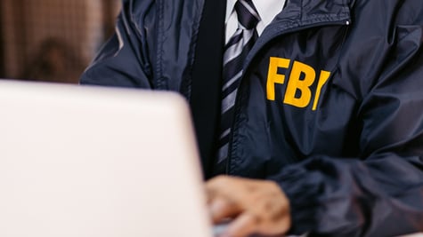 FBI Detective Using Laptop In His Office