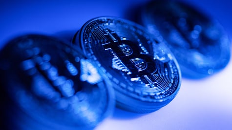 Bitcoin coins in blue background