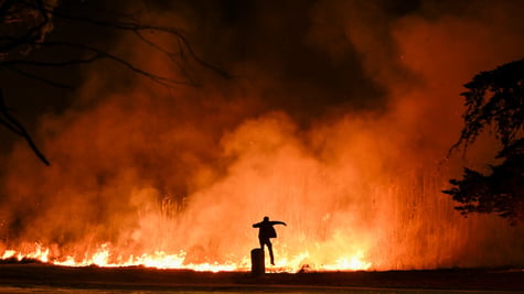 la-wildfires-man-jumping