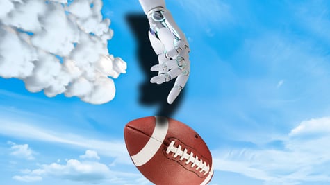 A robotic arm next to a football in the sky.