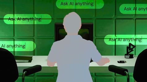 Person sitting in front of a computer, interacting with an AI chatbot