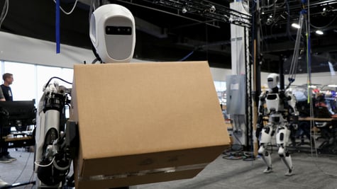 Apptronik humanoid robot carrying a box