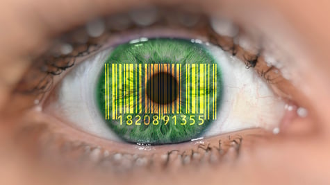 Detail of eye with barcode EANan Article Number, on iris, symbolic image