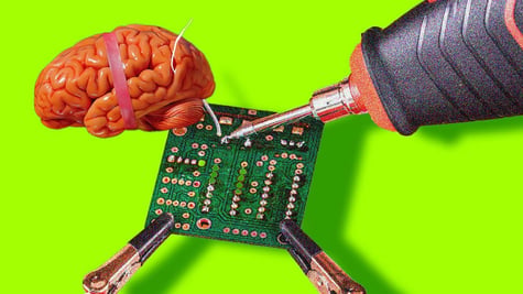 Tech soldering a brain.