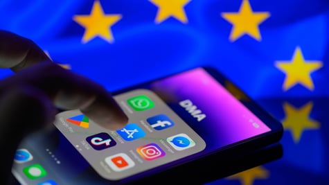 iPhone with major apps, EU flag in backround