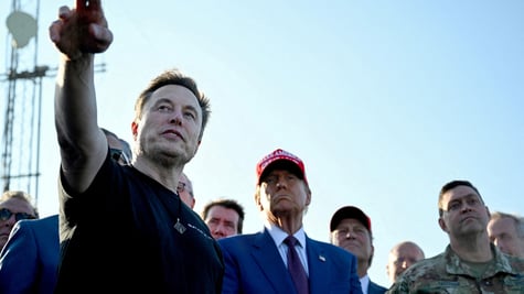 Elon Musk pointing, Donal Trump looking on