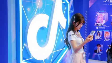 A Tiktok anime influencer next to Tiktok's logo.