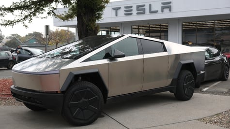 Cybetruck parked in front of Tesla store