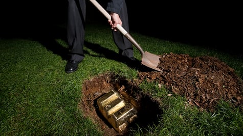 Man burying gold