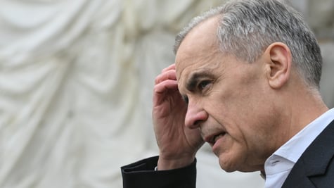 Mark Carney scratching his head.