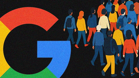 group of people walking away from Google logo