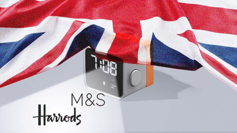 UK flag with alarm clock, M&S and Harrods logos