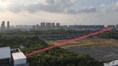 red laser beam over a field