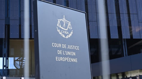 Court Justice of the European Union logo in front of glass building