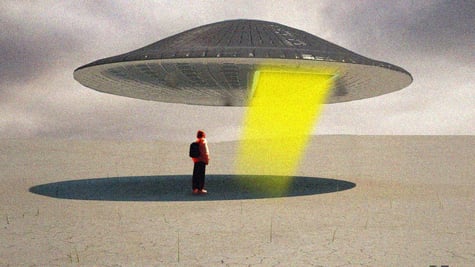 Someone standing next to a UFO.