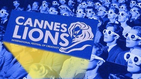 A Cannes audience watching a show wearing 3D glasses.