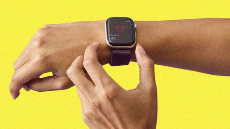 Apple Watch on a wrist measuring a heart beat