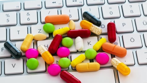 Pills on a keyboard.