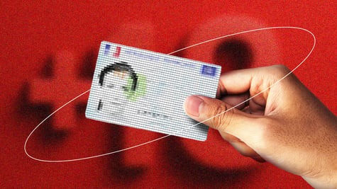 personal id card from france held in hand, blurry female face, +18 in the background