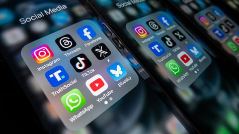 instagram, whatsapp, bluesky, facebook, x icons on screen