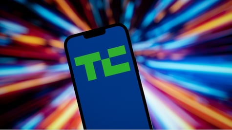 green techcrunch logo in blue background telephone screen