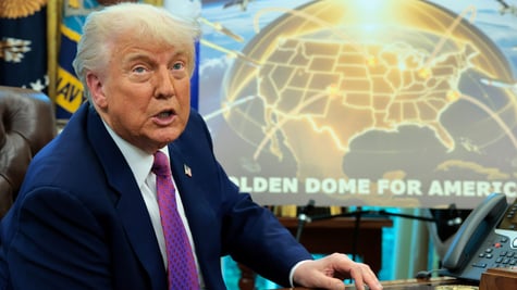 donald trump in blue suit, purple tie, shite shirt neext to golden dome