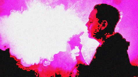 A man vaping into a pink sky.