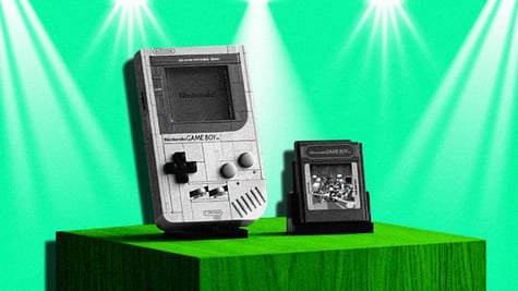 old nintendo game boy in black and white, green background